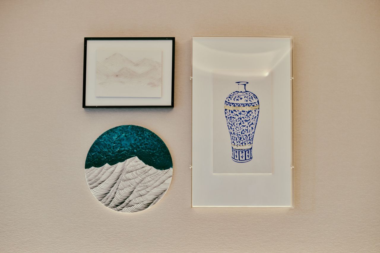 services-01 A collection of framed minimalist art on a textured wall, perfect for home decor.